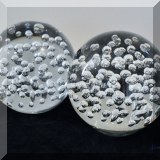 G23. Pair of bubble glass spheres. 